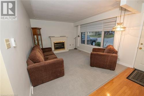 180 Miller Street, Mount Forest, ON - Indoor Photo Showing Living Room With Fireplace