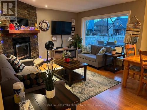 1884 Simcoe Boulevard, Innisfil, ON - Indoor Photo Showing Living Room With Fireplace