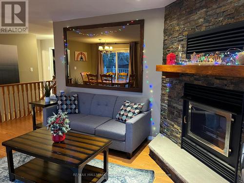 1884 Simcoe Boulevard, Innisfil, ON - Indoor Photo Showing Living Room With Fireplace