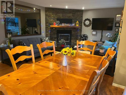 1884 Simcoe Boulevard, Innisfil, ON - Indoor Photo Showing Dining Room With Fireplace