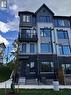 1403 - 160 Densmore Road, Cobourg, ON  - Outdoor With Balcony With Facade 