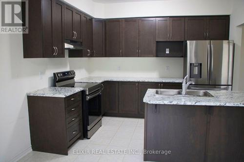 4 Jenner Drive, Brant, ON - Indoor Photo Showing Kitchen With Stainless Steel Kitchen With Double Sink