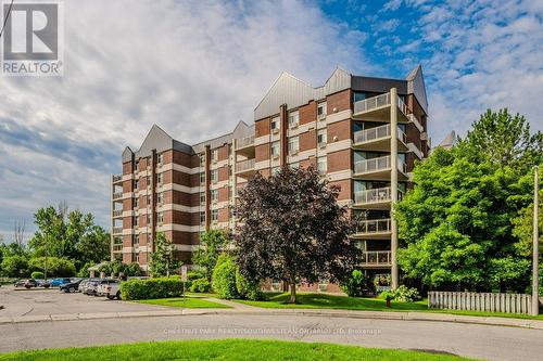 207 - 8 Christopher Court, Guelph, ON - Outdoor With Balcony With Facade