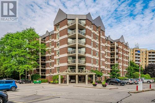 207 - 8 Christopher Court, Guelph, ON - Outdoor With Balcony With Facade