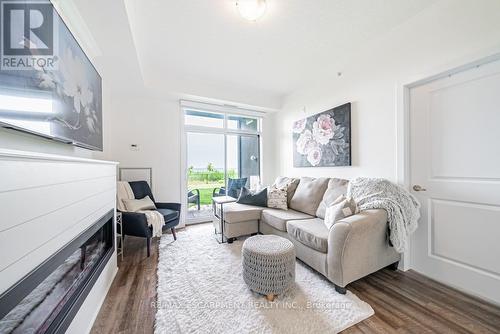 129 - 35 Southshore Crescent, Hamilton, ON - Indoor Photo Showing Living Room With Fireplace