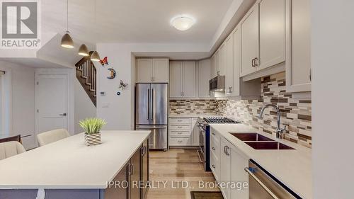 49 - 30 Times Square Boulevard, Hamilton, ON - Indoor Photo Showing Kitchen With Stainless Steel Kitchen With Double Sink With Upgraded Kitchen