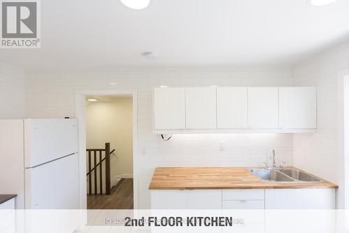 2 - 16 Madison Avenue, Hamilton, ON - Indoor Photo Showing Kitchen With Double Sink