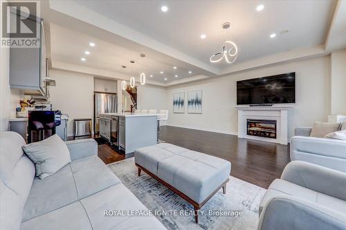 20 Icemaker Way, Whitby, ON - Indoor Photo Showing Living Room With Fireplace