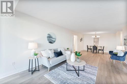 611 - 2350 Bridletowne Circle, Toronto, ON - Indoor Photo Showing Living Room