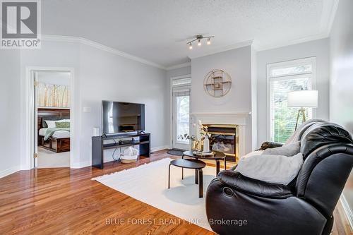 145 - 2025 Meadowgate Boulevard, London, ON - Indoor Photo Showing Living Room With Fireplace