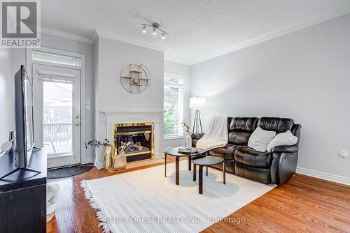 145 - 2025 Meadowgate Boulevard, London, ON - Indoor Photo Showing Living Room With Fireplace