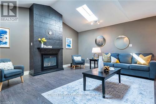 3829 Northwood Drive, Niagara Falls (Mt. Carmel), ON - Indoor Photo Showing Living Room With Fireplace