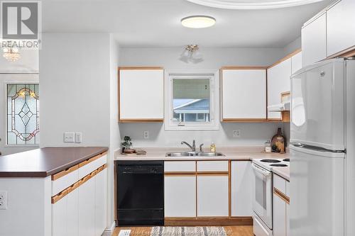 52 Cherry, Mcgregor, ON - Indoor Photo Showing Kitchen With Double Sink