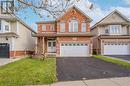 Front of property featuring a garage and a front lawn - 584 Winterburg Walk, Waterloo, ON  - Outdoor With Facade 