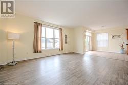 Empty room with light hardwood / wood-style flooring - 