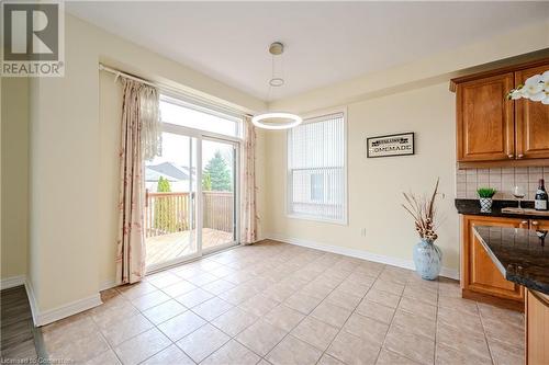 Dining room with light tile patterned floors - 584 Winterburg Walk, Waterloo, ON - Indoor