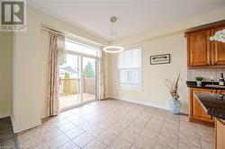 Dining room with light tile patterned floors - 