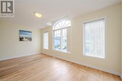 Empty room featuring light wood-type flooring - 