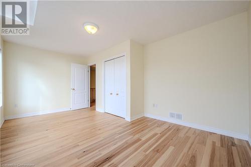 Unfurnished bedroom with a closet, light hardwood / wood-style flooring, and a skylight - 584 Winterburg Walk, Waterloo, ON - Indoor Photo Showing Other Room