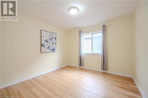 Empty room featuring light hardwood / wood-style floors - 584 Winterburg Walk, Waterloo, ON - Indoor Photo Showing Other Room