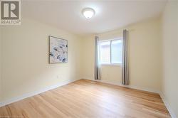 Empty room featuring light hardwood / wood-style floors - 