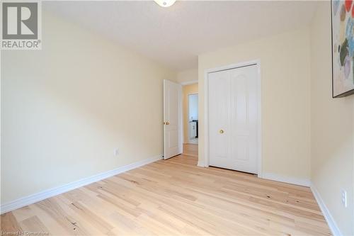 Unfurnished bedroom featuring a closet and light wood-type flooring - 584 Winterburg Walk, Waterloo, ON - Indoor Photo Showing Other Room