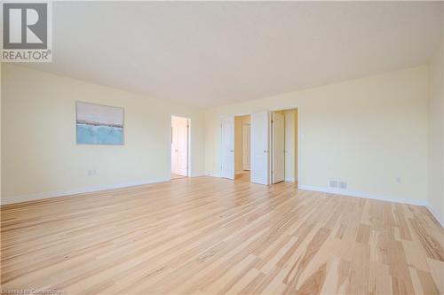 Spare room featuring light wood-type flooring - 584 Winterburg Walk, Waterloo, ON - Indoor Photo Showing Other Room