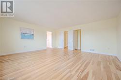 Spare room featuring light wood-type flooring - 