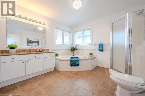 Full bathroom with tile patterned flooring, vanity, toilet, and plus walk in shower - 584 Winterburg Walk, Waterloo, ON - Indoor Photo Showing Bathroom