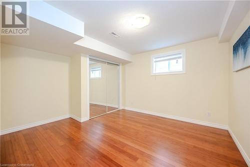 Basement with hardwood / wood-style flooring - 584 Winterburg Walk, Waterloo, ON - Indoor Photo Showing Other Room