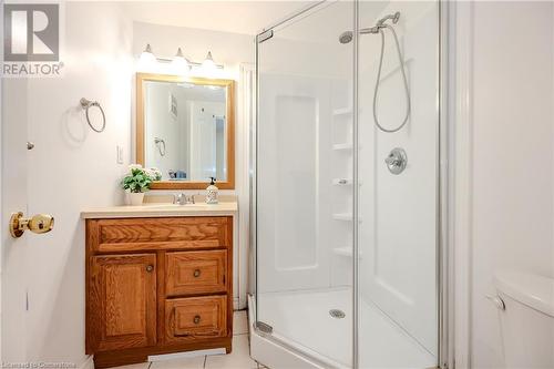 Bathroom with tile patterned floors, vanity, toilet, and a shower with door - 584 Winterburg Walk, Waterloo, ON - Indoor Photo Showing Bathroom