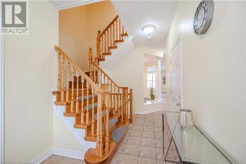 Stairs with tile patterned floors and ornate columns - 584 Winterburg Walk, Waterloo, ON - Indoor Photo Showing Other Room