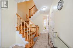 Stairs with tile patterned floors and ornate columns - 