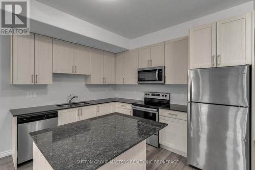 204 - 1015 Terra Verde Way, Kingston (City Northwest), ON - Indoor Photo Showing Kitchen With Double Sink