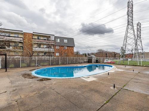 Pool - 303-6320 Place Bonaventure, Brossard, QC - Outdoor With In Ground Pool