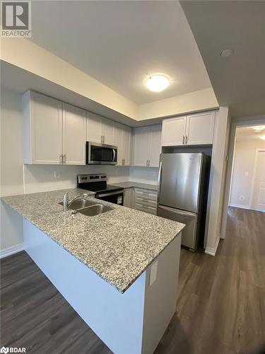 1581 Rose Way Unit# 513, Milton, ON - Indoor Photo Showing Kitchen With Double Sink With Upgraded Kitchen