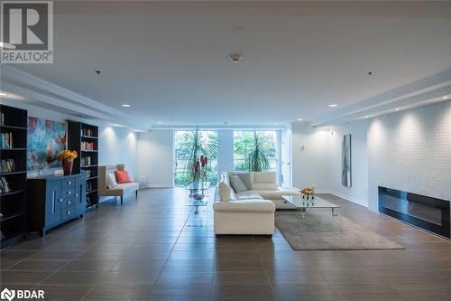 Welcoming Entry For Guests - 1421 Costigan Road Unit# 501, Milton, ON - Indoor Photo Showing Living Room With Fireplace