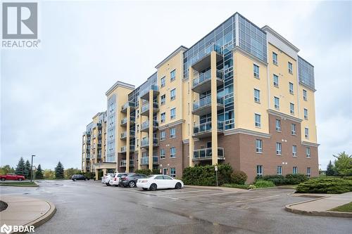 Loads of Visitor Parking - 1421 Costigan Road Unit# 501, Milton, ON - Outdoor With Balcony With Facade