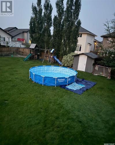 334 Rempel Bay, Saskatoon, SK - Outdoor With Above Ground Pool With Backyard