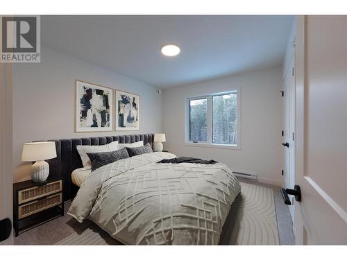 *virtually staged* - 1444 Granite Drive Unit# 9, Golden, BC - Indoor Photo Showing Bedroom