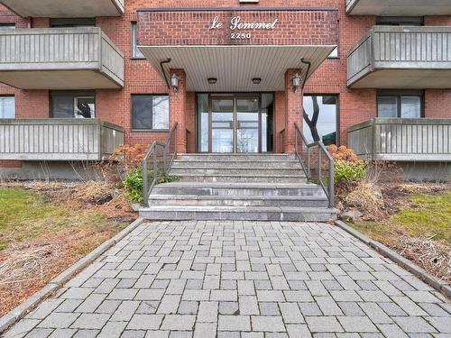 Exterior entrance - 602-2250 Boul. Thimens, Montréal (Saint-Laurent), QC - Outdoor With Deck Patio Veranda