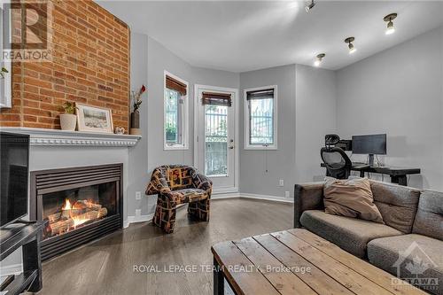 1 - 513 King Edward Avenue, Ottawa, ON - Indoor Photo Showing Living Room With Fireplace