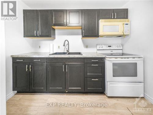 43 Government Road E, Kirkland Lake (Kl & Area), ON - Indoor Photo Showing Kitchen With Double Sink