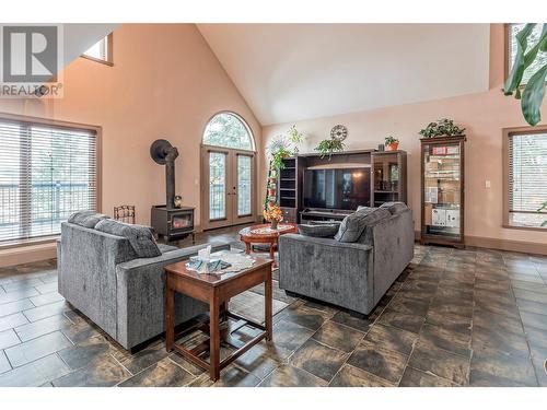 1618 Simons Road, Spallumcheen, BC - Indoor Photo Showing Living Room With Fireplace