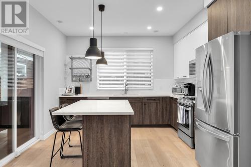 Bright, modern kitchen with patio access - 1933 Ethel Street, Kelowna, BC - Indoor Photo Showing Kitchen With Stainless Steel Kitchen With Upgraded Kitchen