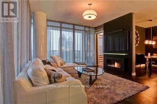 1808 - 88 Park Lawn Road, Toronto, ON - Indoor Photo Showing Living Room With Fireplace