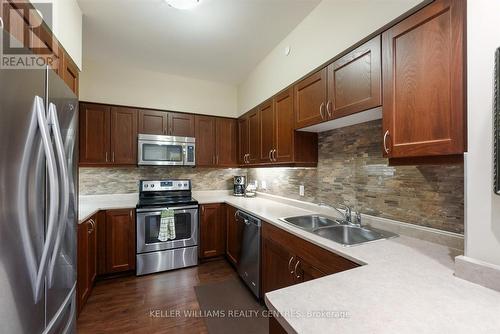 301 - 400 William Graham Drive, Aurora, ON - Indoor Photo Showing Kitchen With Stainless Steel Kitchen With Double Sink