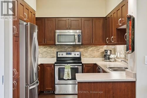 301 - 400 William Graham Drive, Aurora, ON - Indoor Photo Showing Kitchen With Stainless Steel Kitchen With Double Sink With Upgraded Kitchen