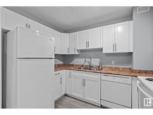 #308 9710 105 St Nw, Edmonton, AB - Indoor Photo Showing Kitchen With Double Sink