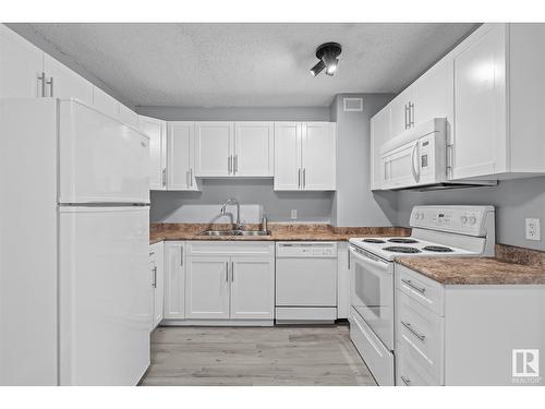 #308 9710 105 St Nw, Edmonton, AB - Indoor Photo Showing Kitchen With Double Sink